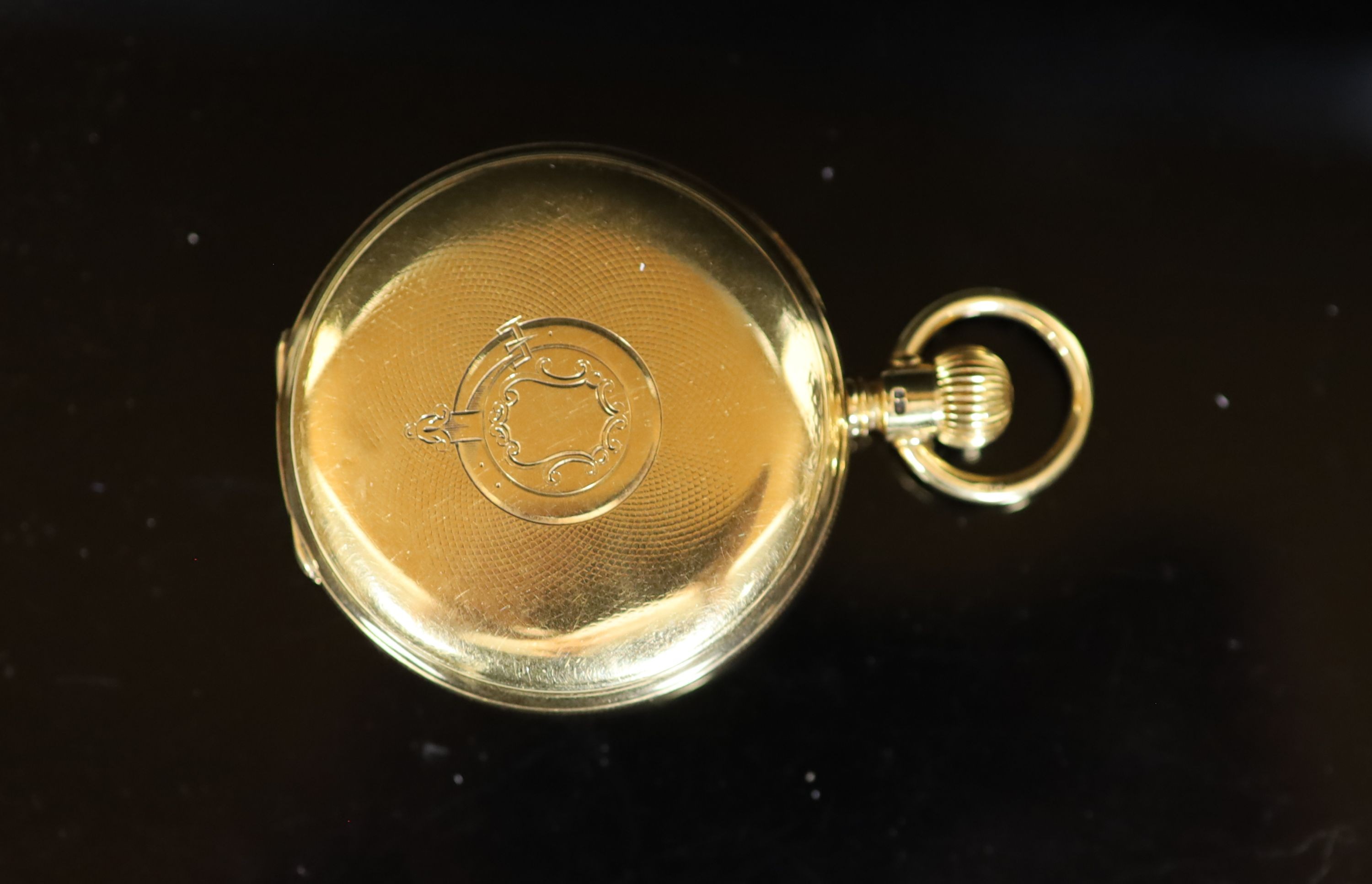 A late Victorian engine turned 18ct gold A W. Co Waltham hunter keyless lever pocket watch